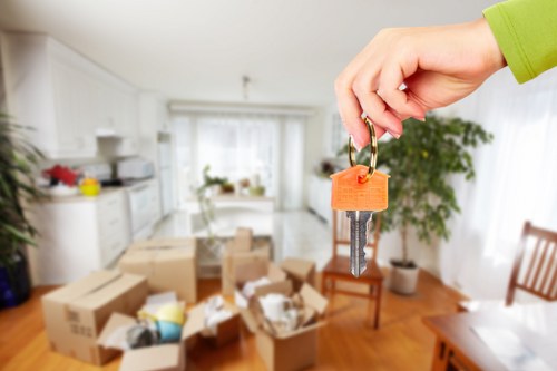 Professional movers loading furniture for a London relocation