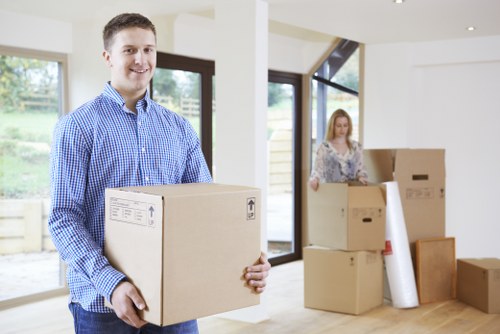 Moving boxes and furniture prepared for a London flat move