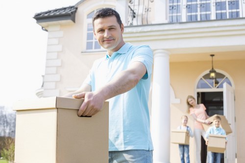 Mover using protective equipment during a careful home move