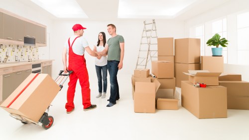 Team assessing moving risks before lifting furniture